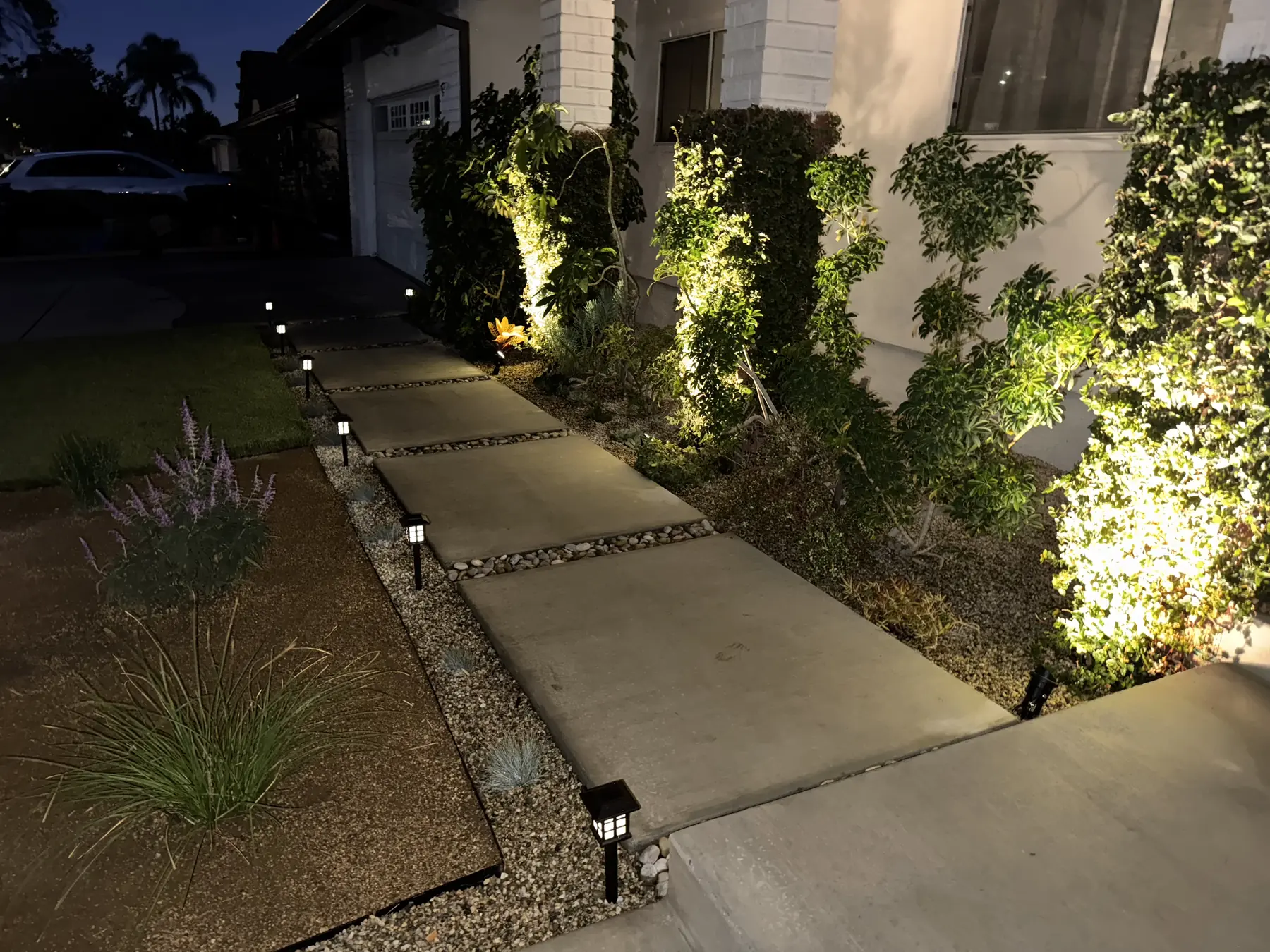 Stepping stone pathway with low voltage lighting at night